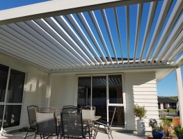 Freestanding Bask Louvre Roof fitted on North Facing Patio opened up to let the winter sun in